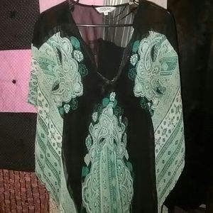 Black and turquoise sheer top.